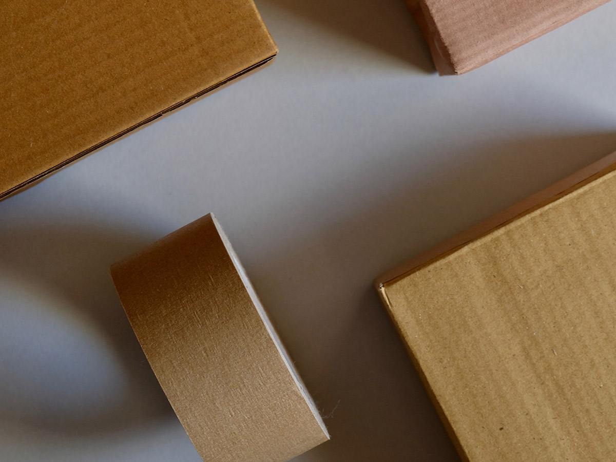 Use tape, cardboard, and decorations to create a life-sized gingerbread house!