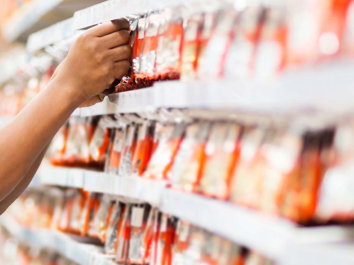 Section of shelves full of wood screws and fasteners in an Ace Hardware store aisle.