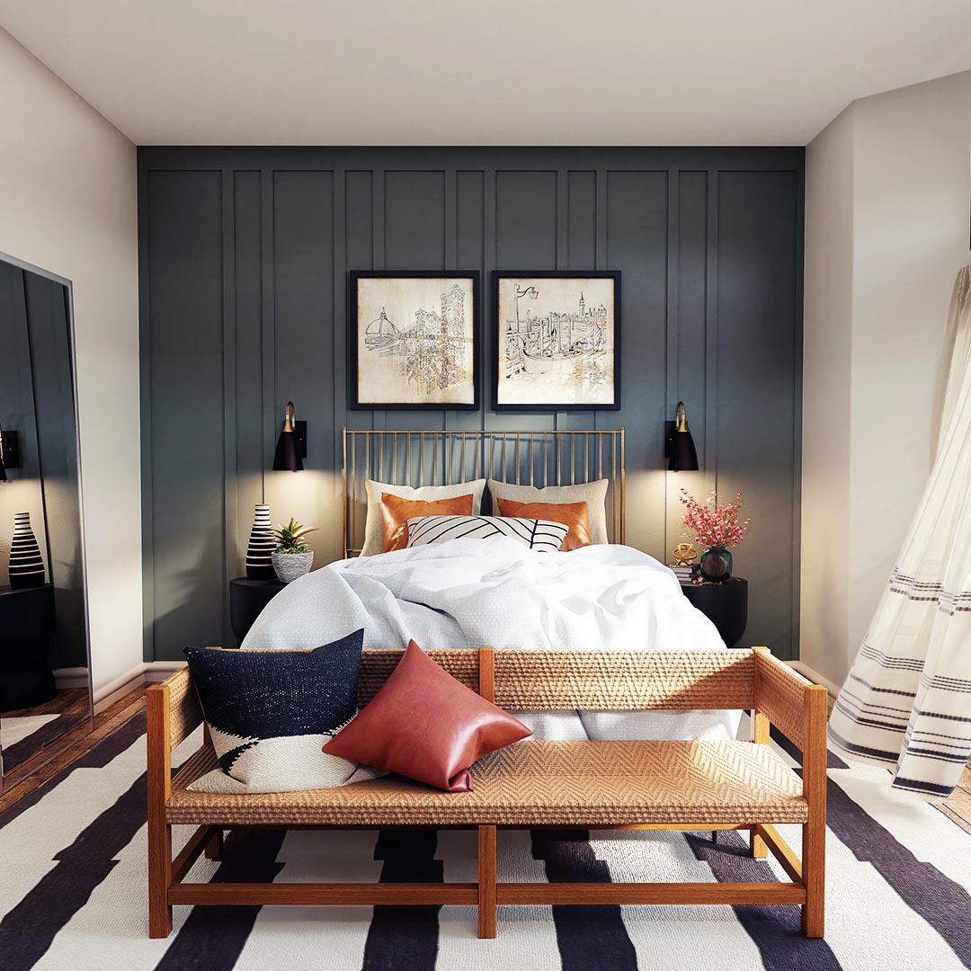 bedroom with a paneled, gray accent wall